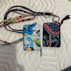 2 Vera Bradley Zip ID holders.